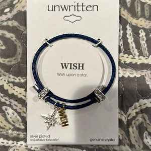 Pretty blue faux leather charm bracelet. Silver and gold charms